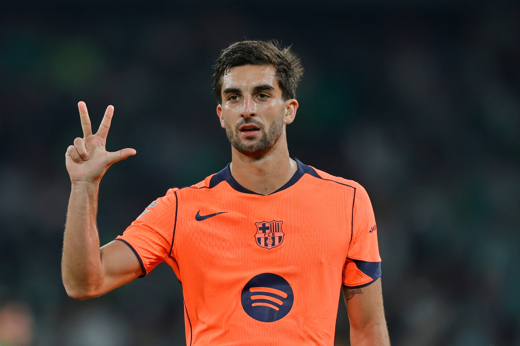 Barcelona's Ferran Torres celebrates after scoring his side 4th goal and his third goal of the game during the Spanish La Liga soccer match between Real Betis and Barcelona in Seville, Spain, Saturday, Dec. 6, 2025. (AP Phot/Manu Reino)