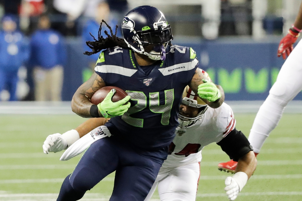 FILE - Seattle Seahawks running back Marshawn Lynch carries against the San Francisco 49ers during the second half of an NFL football game, Sunday, Dec. 29, 2019, in Seattle. (AP Photo/Ted S. Warren, File)