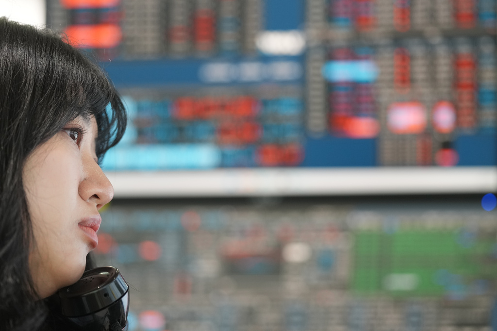 A dealer talks on the phone at a dealing room of Hana Bank in Seoul, South Korea, Wednesday, May 13, 2026. (AP Photo/Lee Jin-man)
