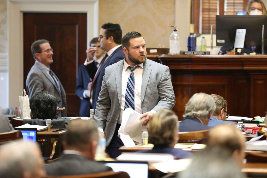 FILE - South Carolina Rep. RJ May, R-West Columbia, walks down the aisle of the House on Tuesday, March 14, 2023, in Columbia, South Carolina. (AP Photo/Jeffrey Collins,File)