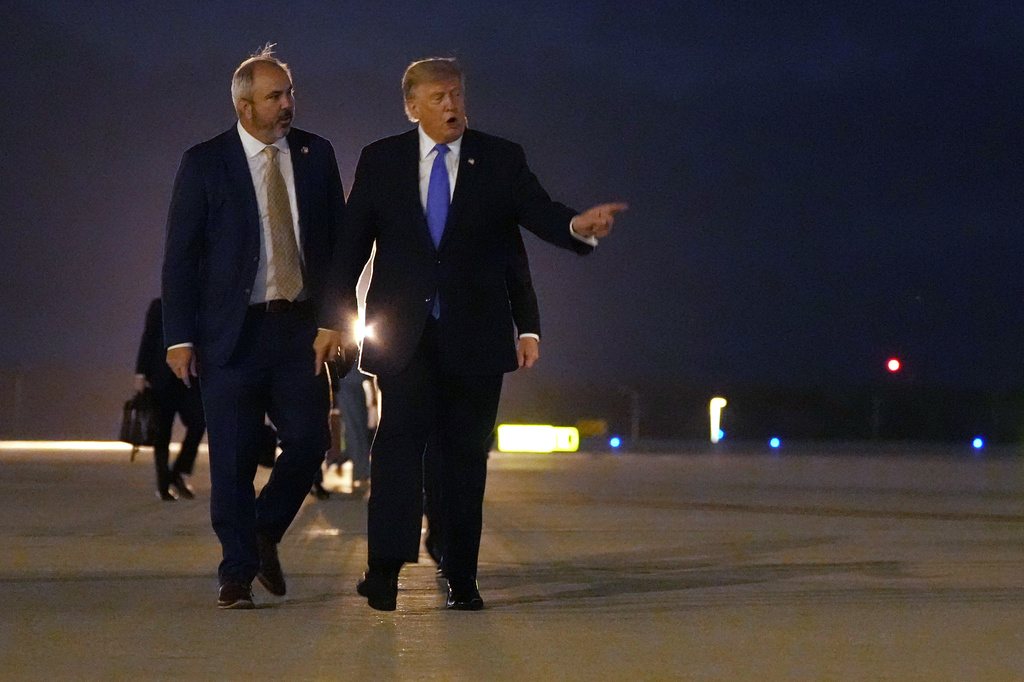 President Donald Trump walks to board Air Force One, Tuesday, Aug. 4, 2026, at Los Angeles International Airport in Los Angeles. (AP Photo/Mark Schiefelbein)