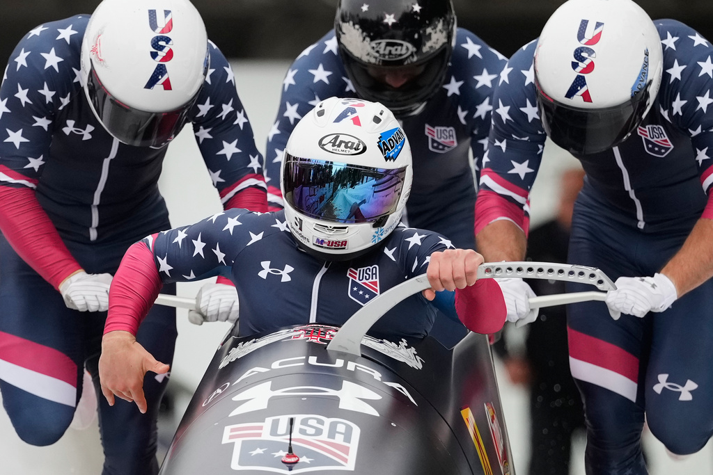 FILE -Frank del Duca, Joshua Williamson, Boone Niederhofer and Bryce Cheek, of the United States, compete in the 4-man bobsleigh race at the Bobsleigh World Cup in Innsbruck, Austria, Nov. 30, 2025. (AP Photo/Matthias Schrader, File)