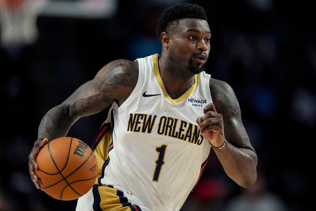New Orleans Pelicans forward Zion Williamson (1) drives against the Houston Rockets during the second half of an NBA preseason basketball game, Tuesday, Oct. 14, 2025, in Birmingham, Ala. (AP Photo/Mike Stewart)