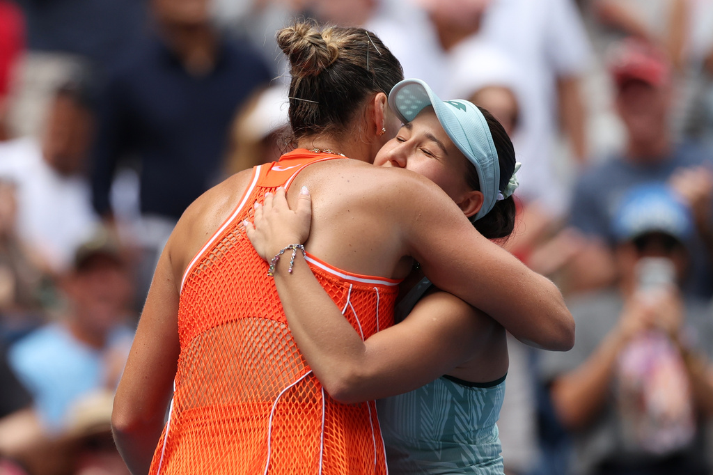 Aryna Sabalenka, of Belarus, left, embraces Kamilla Rakhimova, of Uzbekistan, after Sabalenka won their match during the third round of the U.S. Open tennis championships Friday, Sept. 4, 2026, in New York. (AP Photo/Heather Khalifa)