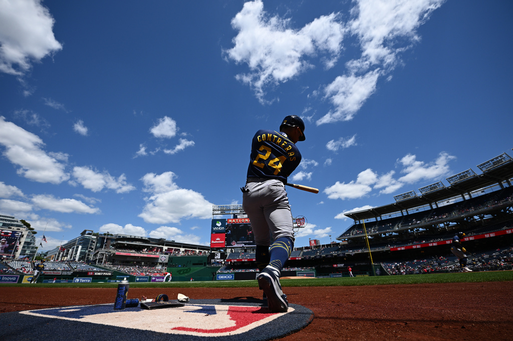 Milwaukee Brewers' William Contreras warms up on-deck before a baseball game against the Washington Nationals, Sunday, May 3, 2026, in Washington. (AP Photo/Nick Wass)