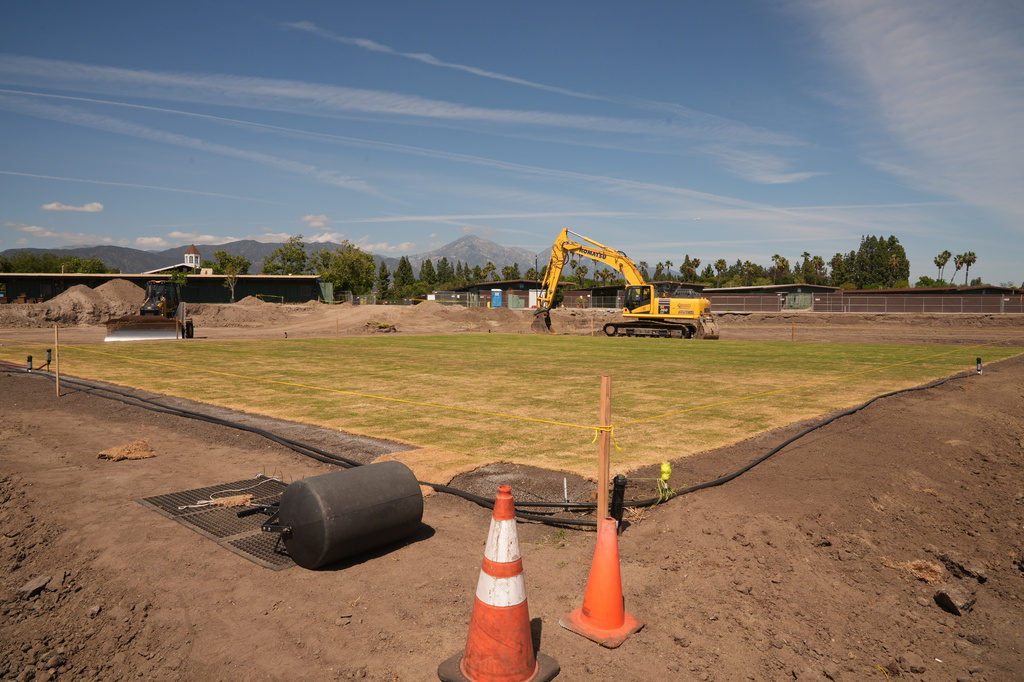New fresh grass is grown for a world-class cricket pitch at the Pomona Fairplex on Wednesday, April 22, 2026, seen during the groundbreaking of the new Knight Riders Cricket Field, which will serve as the Los Angeles Knight Riders' official home field for 2026 and later host cricket at the LA 2028 Olympics. (AP Photo/Damian Dovarganes)