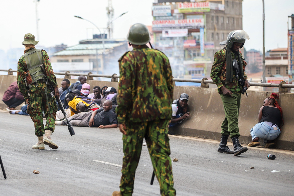 Kenyan anti-riot Police confront protesters during a public transport strike over fuel prices in Nairobi, Kenya, Monday, May 18, 2026. (AP Photo/Patrick Ngugi)
