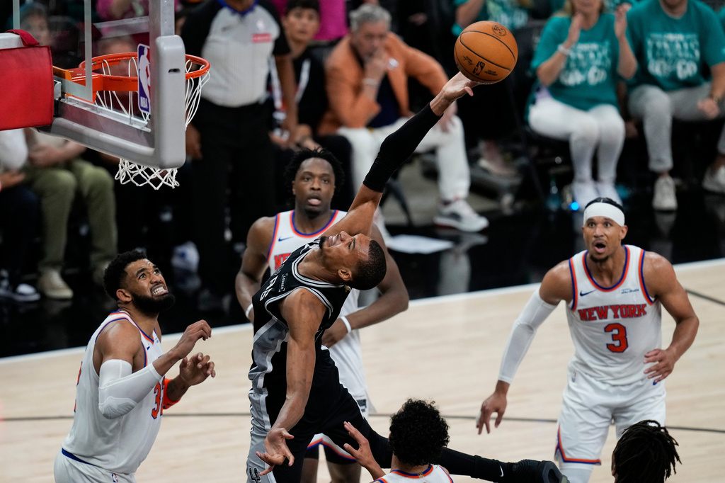 San Antonio Spurs forward Victor Wembanyama tries to shoot against the New York Knicks during the second half of Game 1 of the NBA Finals basketball series, Wednesday, June 3, 2026, in San Antonio. (AP Photo/David J. Phillip)
