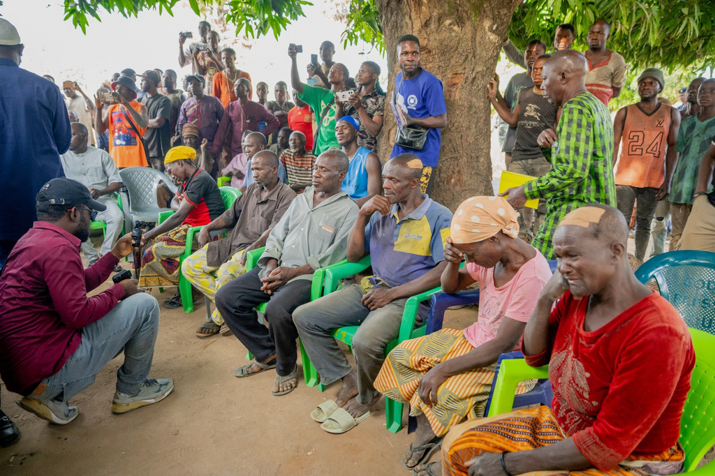 In this photo released by the Kaduna State government, people react during a meeting with Kaduna state Governor. Uba Sani, after gunmen attack in Kurmin Wali, northwest Nigeria, Wednesday, Jan. 21, 2026. (Kaduna State Government via AP)