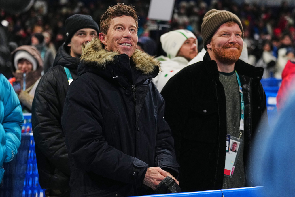 Shaun White watches competition during the men's snowboarding halfpipe qualifications at the 2026 Winter Olympics, in Livigno, Italy, Wednesday, Feb. 11, 2026. (AP Photo/Abbie Parr)