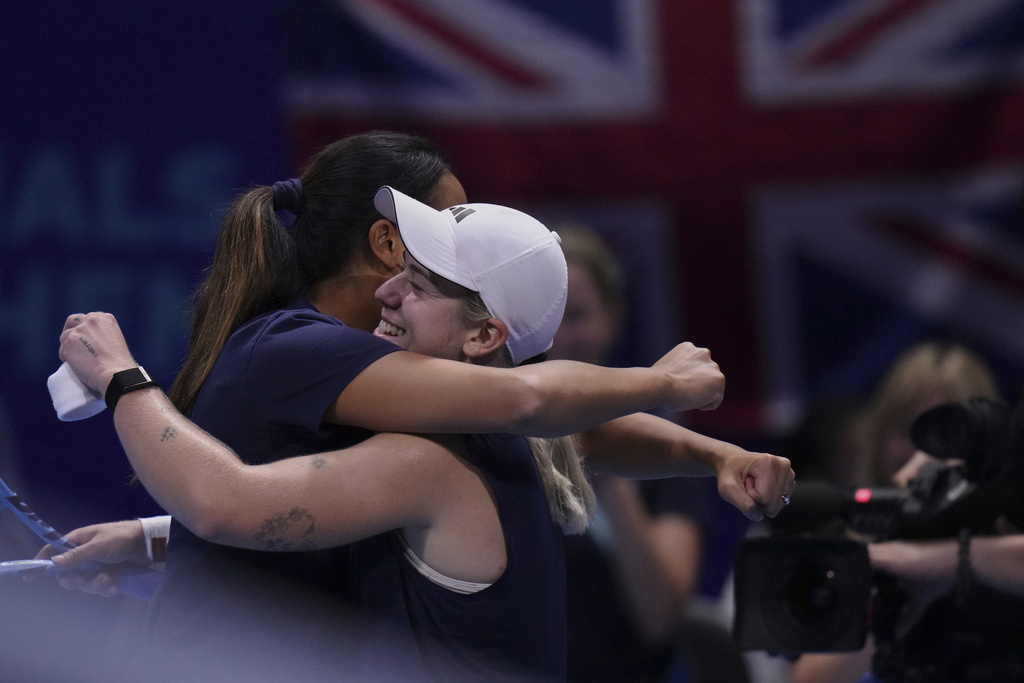 Sonay Kartal, of Great Britain, right, celebrates with her team captain Anne Keothavong after defeating Ena Shibahara, of Japan in the Billie Jean King Cup quarterfinals tennis match, at the Shenzhen Bay Sports Center Arena, in Shenzhen, China's Guangdong province, Thursday, Sept. 18, 2025. (AP Photo/Andy Wong)