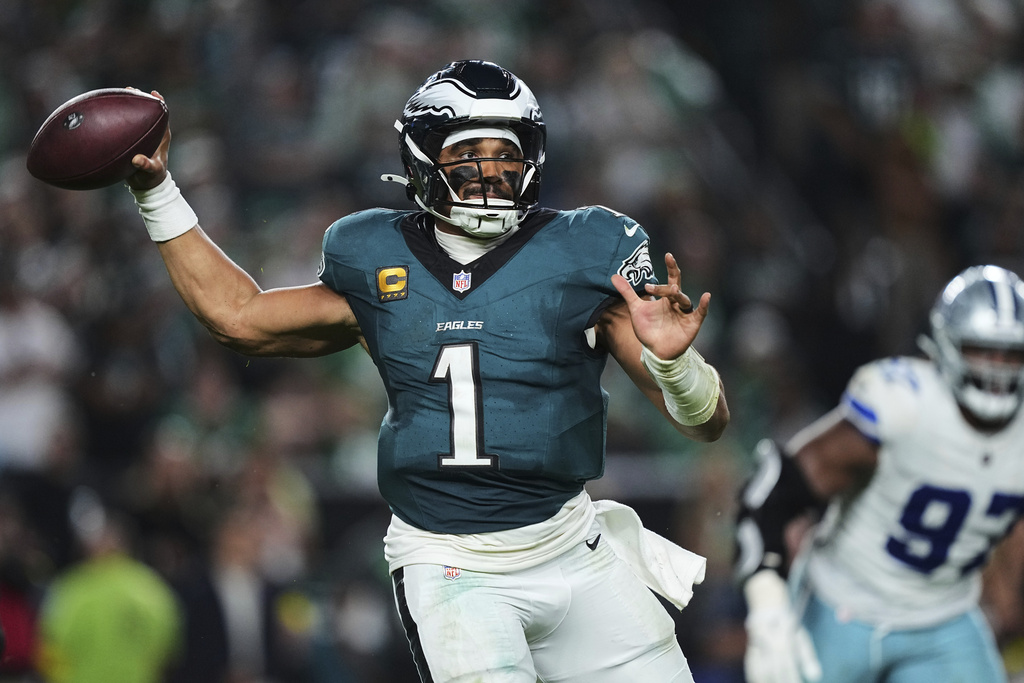 Philadelphia Eagles quarterback Jalen Hurts (1) throws a pass in the second half of an NFL football game against the Dallas Cowboys Friday, Sept. 5, 2025, in Philadelphia. (AP Photo/Matt Rourke)