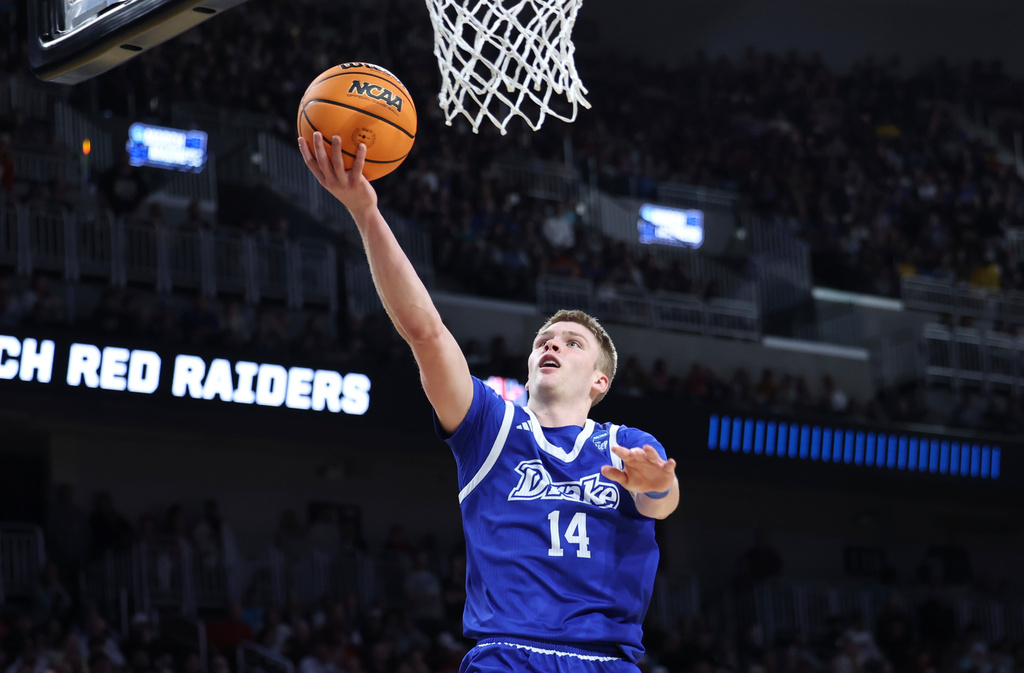 FILE - Drake guard Bennett Stirtz (14) , who has since transferred to Iowa, makes a layup during the second half against Texas Tech in the second round of the NCAA college basketball tournament, Saturday, March 22, 2025, in Wichita, Kan. (AP Photo/Travis Heying, File) FILE - Drake guard Bennett Stirtz (14) , who has since transferred to Iowa, makes a layup during the second half against Texas Tech in the second round of the NCAA college basketball tournament, Saturday, March 22, 2025, in Wichita, Kan. (AP Photo/Travis Heying, File)