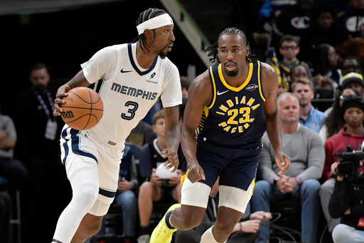 Memphis Grizzlies guard Kentavious Caldwell-Pope (3) handles the ball against Indiana Pacers guard Aaron Nesmith (23) in the first half of an NBA basketball game, Saturday, Oct. 25, 2025, in Memphis, Tenn. (AP Photo/Brandon Dill) Memphis Grizzlies guard Kentavious Caldwell-Pope (3) handles the ball against Indiana Pacers guard Aaron Nesmith (23) in the first half of an NBA basketball game, Saturday, Oct. 25, 2025, in Memphis, Tenn. (AP Photo/Brandon Dill)
