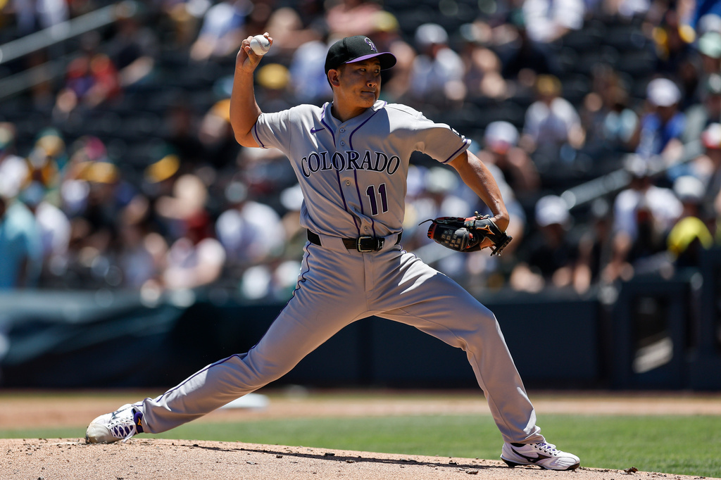 Colorado Rockies starting pitcher Tomoyuki Sugano throws during the first inning of a baseball game against the Athletics, Sunday, June 14, 2026, in Las Vegas. (AP Photo/Caroline Brehman)