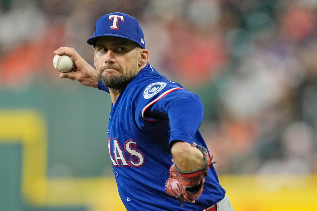 Texas Rangers starting pitcher Nathan Eovaldi throws against the Houston Astros during the first inning of a baseball game Friday, July 31, 2026, in Houston. (AP Photo/David J. Phillip)