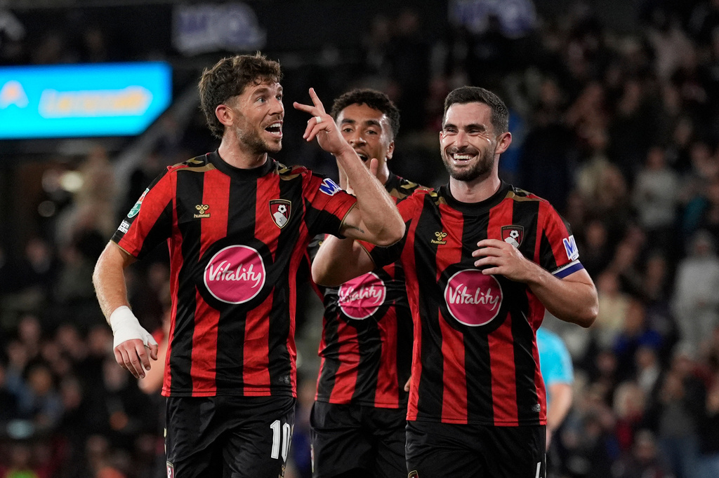 Bournemouth's Ryan Christie, left, celebrates scoring during the League Cup third round soccer match between AFC Bournemouth and Lincoln City in Bournemouth, England, Tuesday Sept. 8, 2026. (Andrew Matthews/PA via AP)
