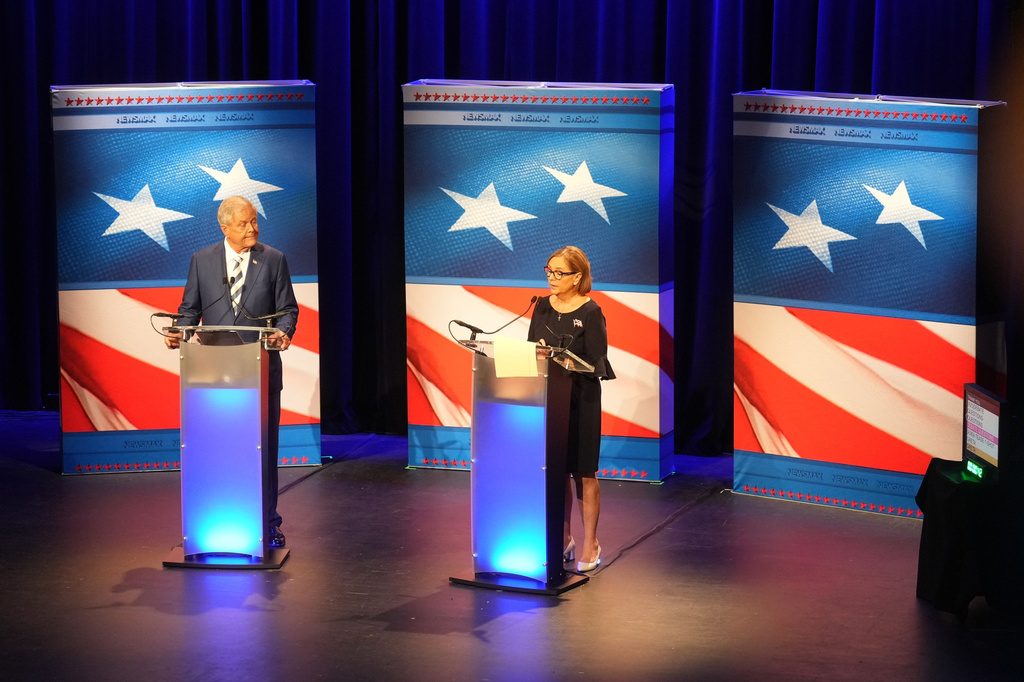 U.S. Rep. Ralph Norman, R-S.C., left, looks on as Sen. Darline Graham, R-S.C., speaks during a special GOP Senate runoff debate to replace the late Sen. Lindsey Graham, R-S.C., on Tuesday, Aug. 18, 2026, in Newberry, S.C. (AP Photo/Meg Kinnard)