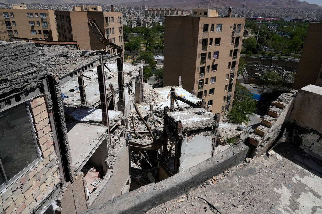 Damage is visible on a residential building that, according to Iranian authorities, was hit by a strike on March 4 during the U.S.-Israeli military campaign, in southeastern Tehran, Iran, Tuesday, April 14, 2026. (AP Photo/Vahid Salemi)