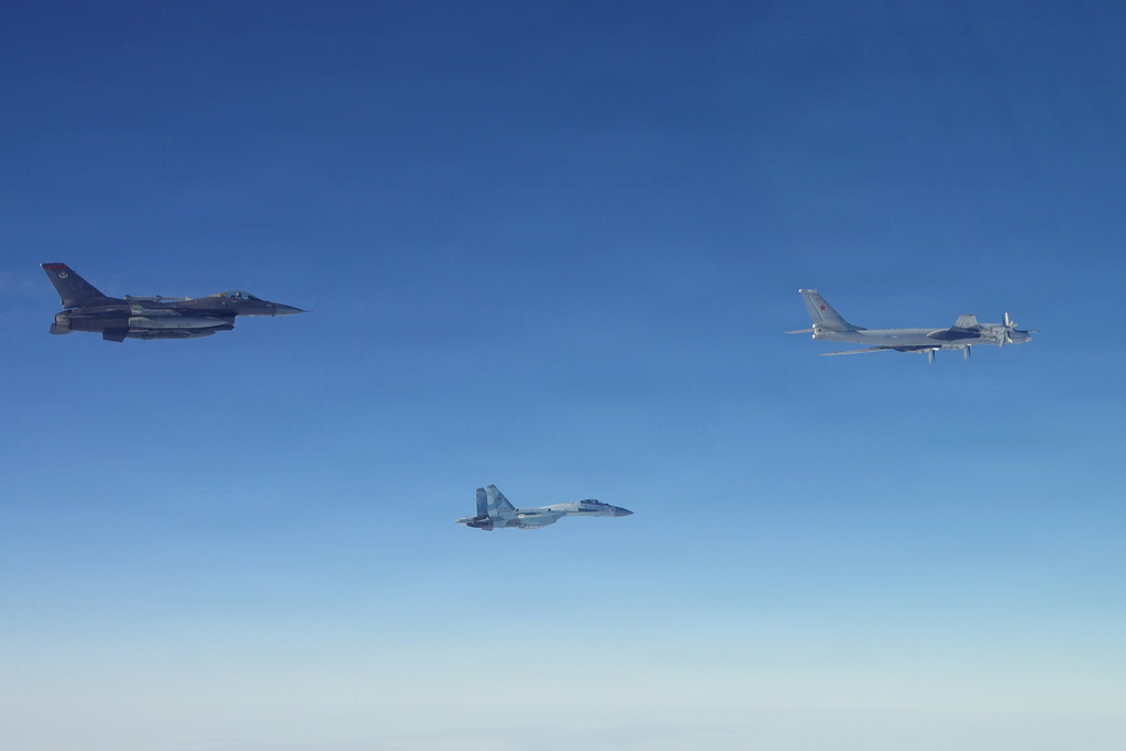 This photo provided by the U.S. Department of Defense shows a North American Aerospace Defense Command F-16 fighter aircraft intercepting Russian Tu-95 and Su-35 military aircraft near the Bering Strait, west of Alaska, on Thursday, Feb. 19, 2026. (Department of Defense photo via AP)