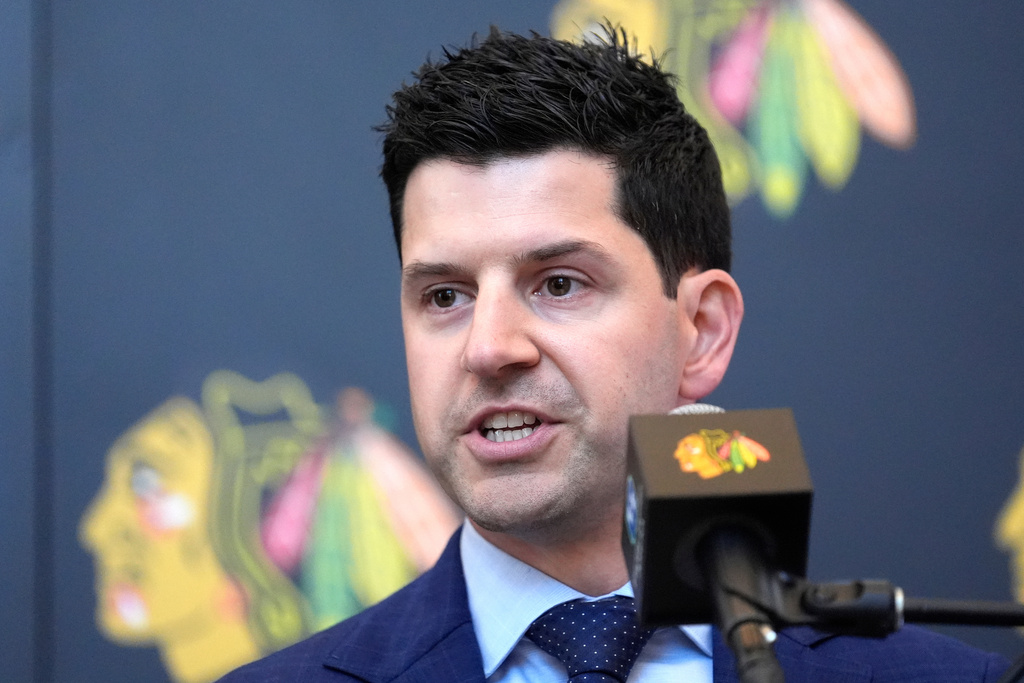FILE - Chicago Blackhawks General manager Kyle Davidson speaks at a news conference during the team's NHL hockey camp Thursday, Sept. 19, 2024, in Chicago. (AP Photo/Charles Rex Arbogast, File)