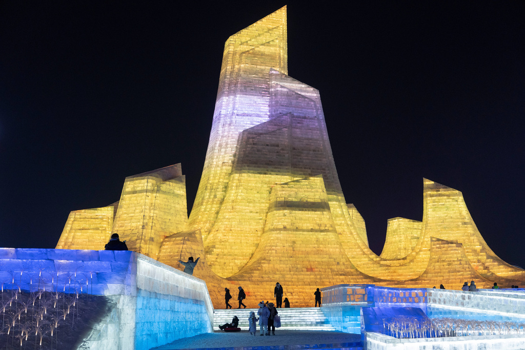 People visit the annual Ice and Snow Festival held in Harbin in China's Heilongjiang province on Saturday, Jan. 3, 2026. (AP Photo/Ng Han Guan)