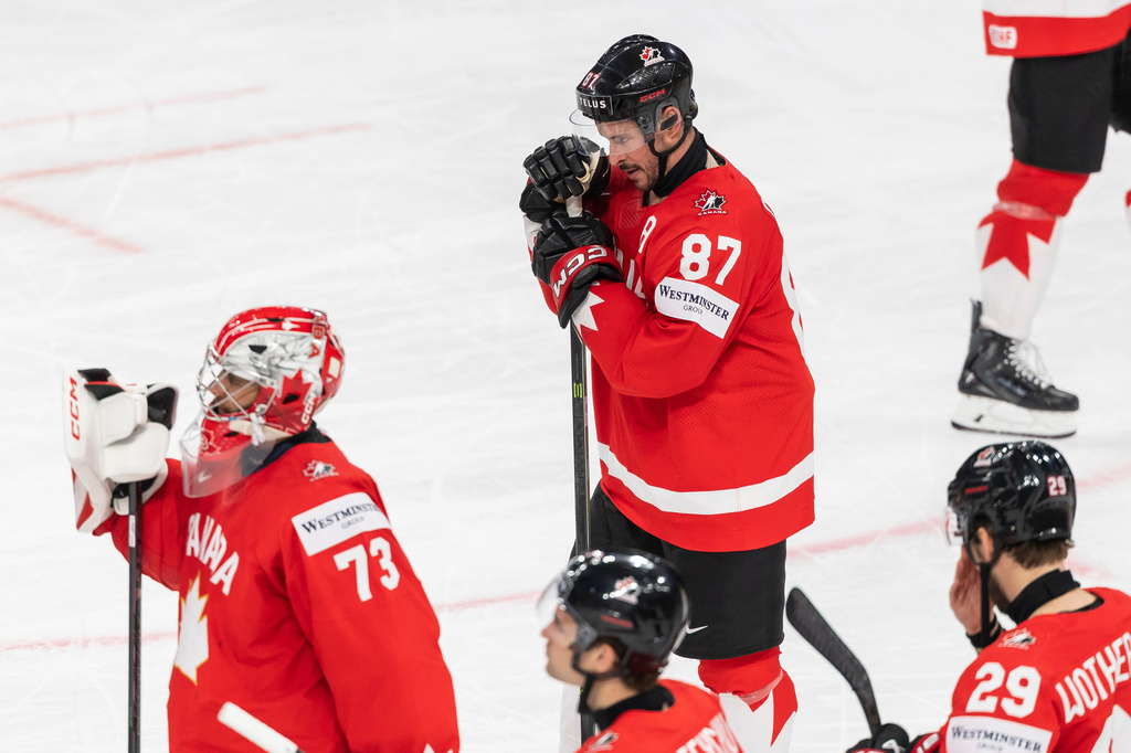 Canada's Sidney Crosby (87) reacts after the semifinal game between Finland and Canada at the men's ice hockey world championship, Saturday, May 30, 2026, in Zurich, Switzerland. (Cyril Zingaro/Keystone via AP)