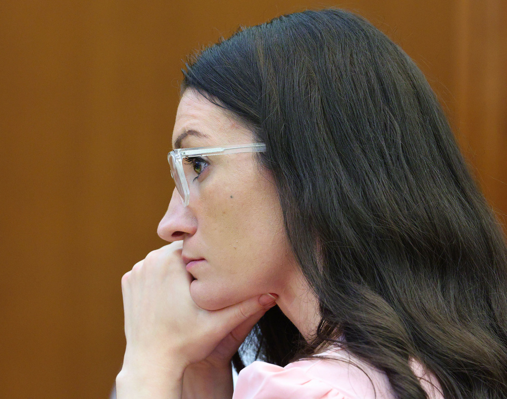 Defendant Lindsay Clancy listens to Dr. Jennifer Tufts on the witness stand during her murder trial at Plymouth Superior Court in Plymouth, Mass., Monday, Aug. 10, 2026. (Greg Derr/The Patriot Ledger via AP, Pool)