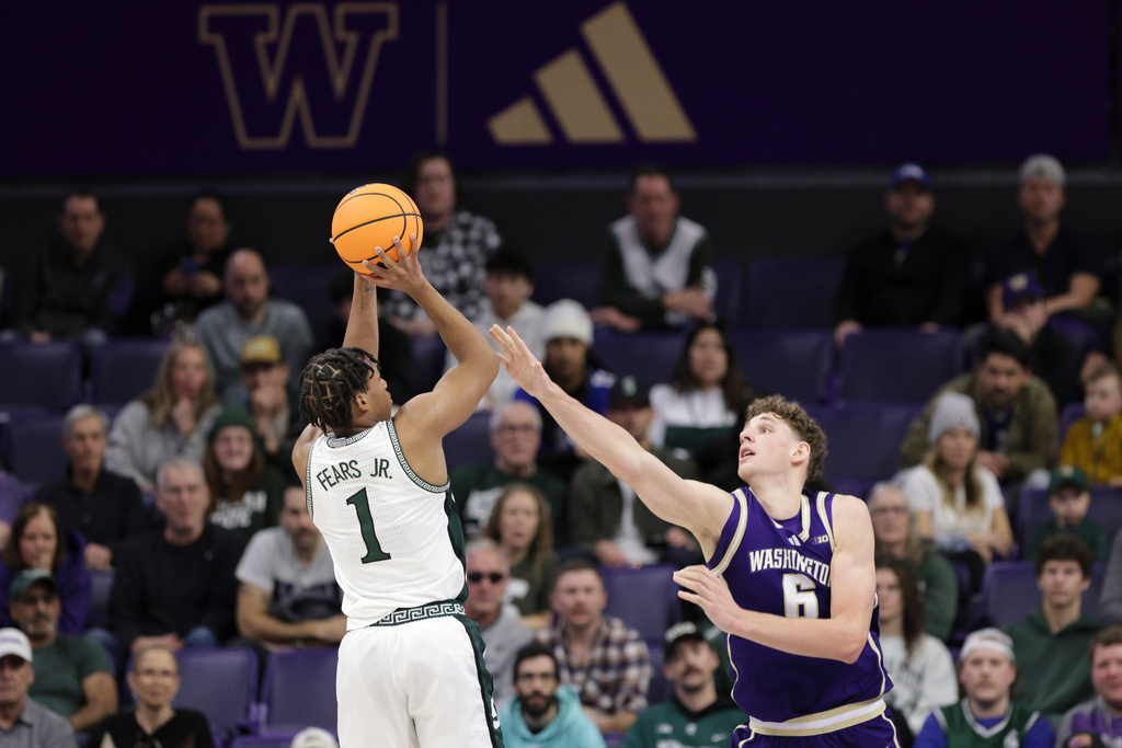 Michigan State guard Jeremy Fears Jr. (1) looks to shoot as Washington forward Hannes Steinbach (6) defends during the first half of an NCAA college basketball game, Saturday, Jan. 17, 2026, in Seattle. (AP Photo/Jason Redmond)