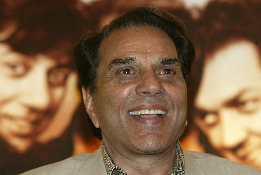 FILE - Bollywood actor and Indian lawmaker Dharmendra reacts during a promotional press conference of his latest film "Apne" in Calcutta, India, Monday, June 25, 2007. (AP Photo/Bikas Das, File)