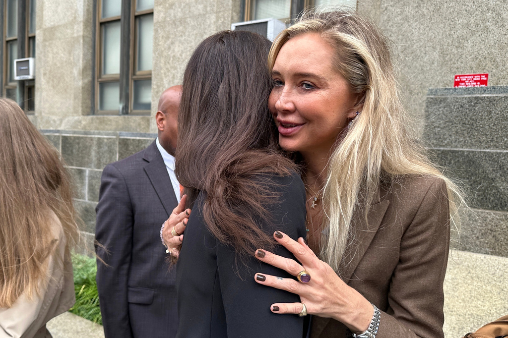 Accuser Kaja Sokola is consoled outside Manhattan Supreme Court after Harvey Weinstein is sentenced to 15 years in prison for sexually assaulting Miriam Haley in 2006, outside Manhattan Supreme Court, Wednesday, Sept. 23, 2026 in New York. (AP Photo/Michael Sisak)