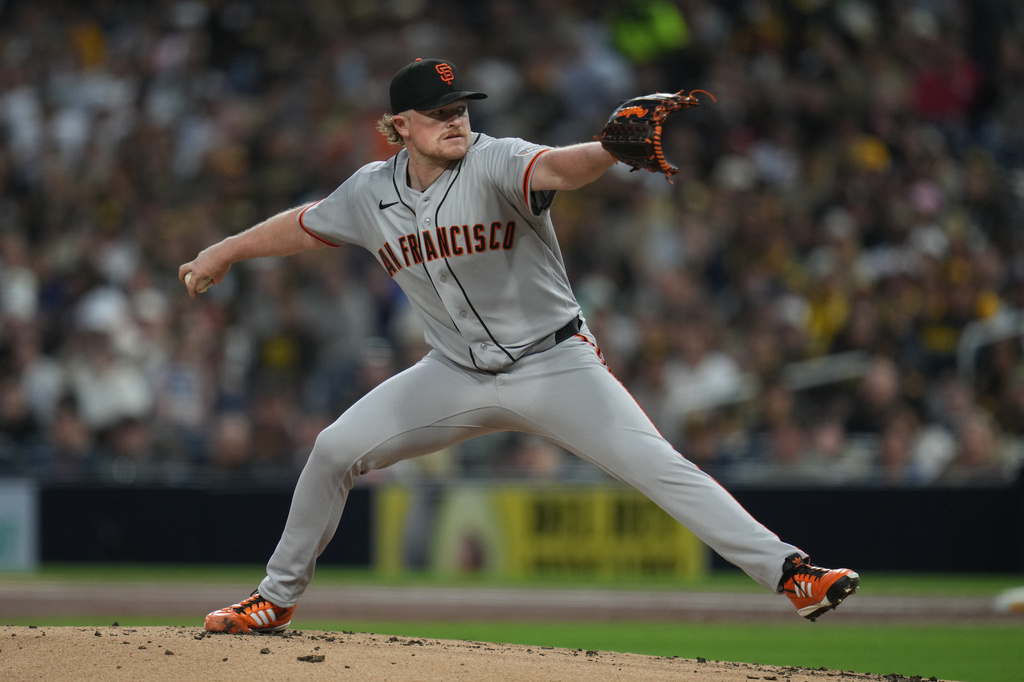 San Francisco Giants starting pitcher Logan Webb works against a San Diego Padres batter during the first inning of a baseball game Tuesday, March 31, 2026, in San Diego. (AP Photo/Gregory Bull)