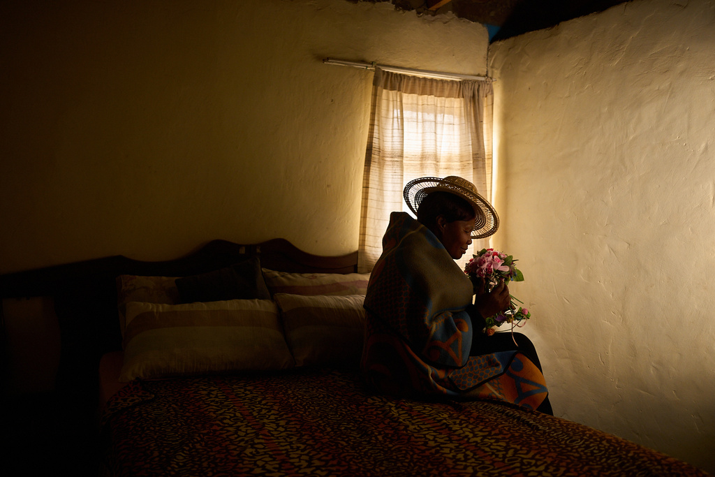 Lisebo Lechela, 54, an HIV-positive sex worker turned activist and health worker, poses for a portrait in her house in Maputsoe, Lesotho, July 17, 2025. (AP Photo/Bram Janssen)