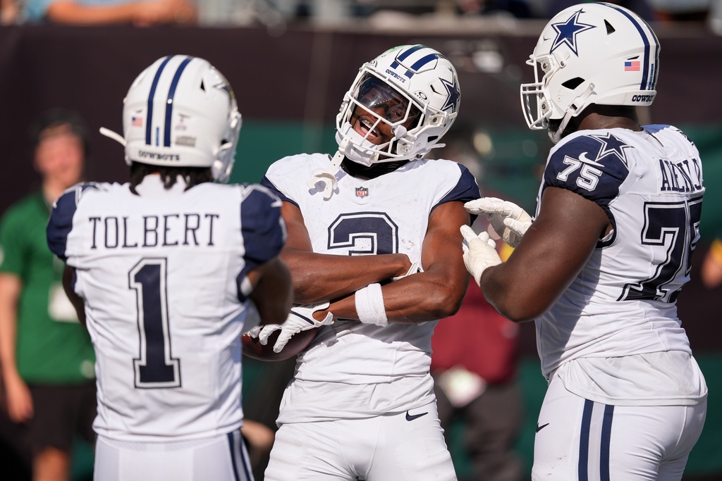 Dallas Cowboys' George Pickens celebrates his touchdown catch during the second half of an NFL football game against the New York Jets Sunday, Oct. 5, 2025, in East Rutherford, N.J. (AP Photo/Seth Wenig)