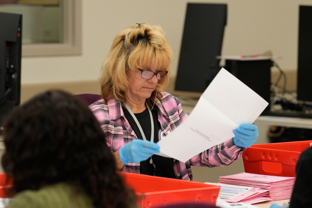 A ballot is inspected at a ballot processing center during the California primary election on Tuesday, June 2, 2026, in Sacramento, Calif.. (AP Photo/Rich Pedroncelli)