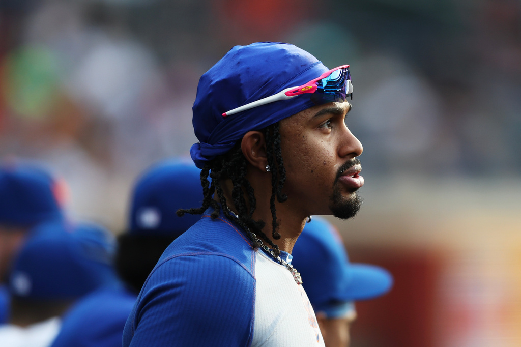 An inured Francisco Lindor looks on from the New York Mets dugout during the eighth inning of a baseball game against the Cincinnati Reds, Monday, May 25, 2026, in New York. (AP Photo/Heather Khalifa)