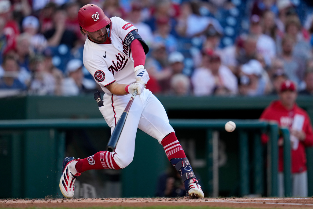 Washington Nationals' Dylan Crews hits a single against the Philadelphia Phillies during the second inning of a baseball game, Tuesday, June 23, 2026, in Washington. (AP Photo/Jess Rapfogel)