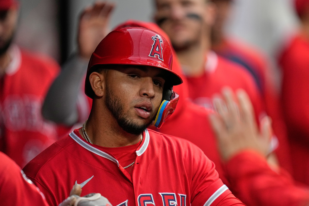 Los Angeles Angels' Oswald Peraza is congratulated after scoring in the sixth inning of a baseball game against the Cleveland Guardians in Cleveland, Tuesday, May 12, 2026. (AP Photo/Sue Ogrocki)
