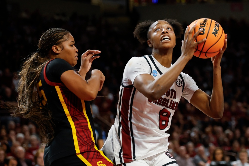 South Carolina forward Joyce Edwards (8) looks to shoot against Southern California guard Kara Dunn during the first half in the second round of the NCAA college basketball tournament, Monday, March 23, 2026, in Columbia, S.C. (AP Photo/Nell Redmond)