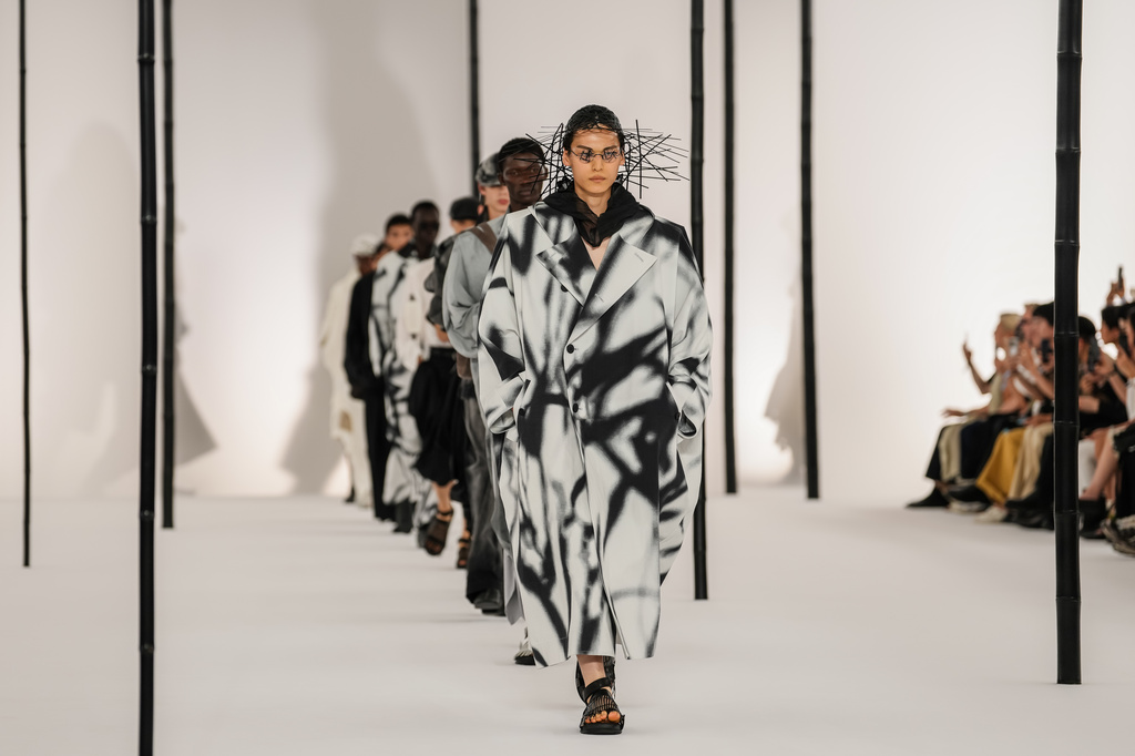 Models wear creations as part of the Issey Miyake Homme Spring Summer 2027 collection presented in Paris, France, Thursday, June 25, 2026. (AP Photo/Aurelien Morissard)