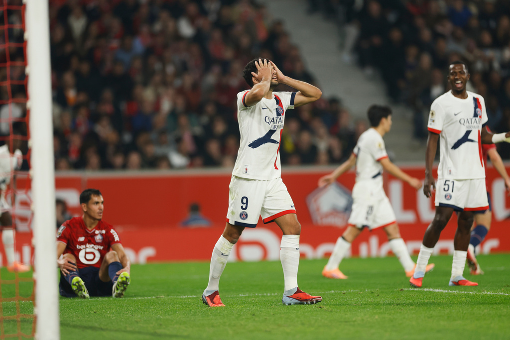 PSG's Goncalo Ramos reacts during the French League One soccer match between Lille and Paris Saint-Germain at the Stade Pierre-Mauroy in Villeneuve-d'Ascq, outside Lille, France, Sunday, Oct. 5, 2025. (AP Photo/Jean-Francois Badias)