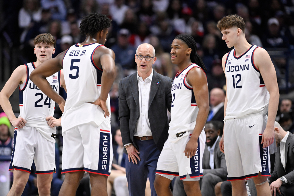UConn head coach Dan Hurley speaks to guard Braylon Mullins (24), forward Tarris Reed Jr. (5), guard Silas Demary Jr. (2) and center Eric Reibe (12) in the first half of an NCAA college basketball game against Seton Hall, Saturday, Feb. 28, 2026, in Storrs, Conn. (AP Photo/Jessica Hill)