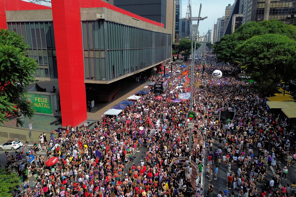 Demonstrators take parte in a march against femicide following a series of high-profile cases in the country, in Sao Paulo, Sunday, Dec. 7, 2025. (AP Photo/Ettore Chiereguini)