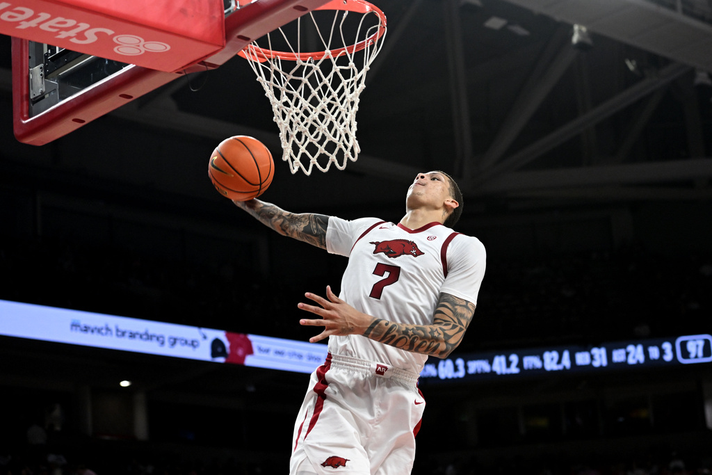 Arkansas forward Trevon Brazile (7) dunks the ball on a fast break against South Carolina during the second half of an NCAA college basketball game Wednesday, Jan. 14, 2026, in Fayetteville, Ark. (AP Photo/Michael Woods)