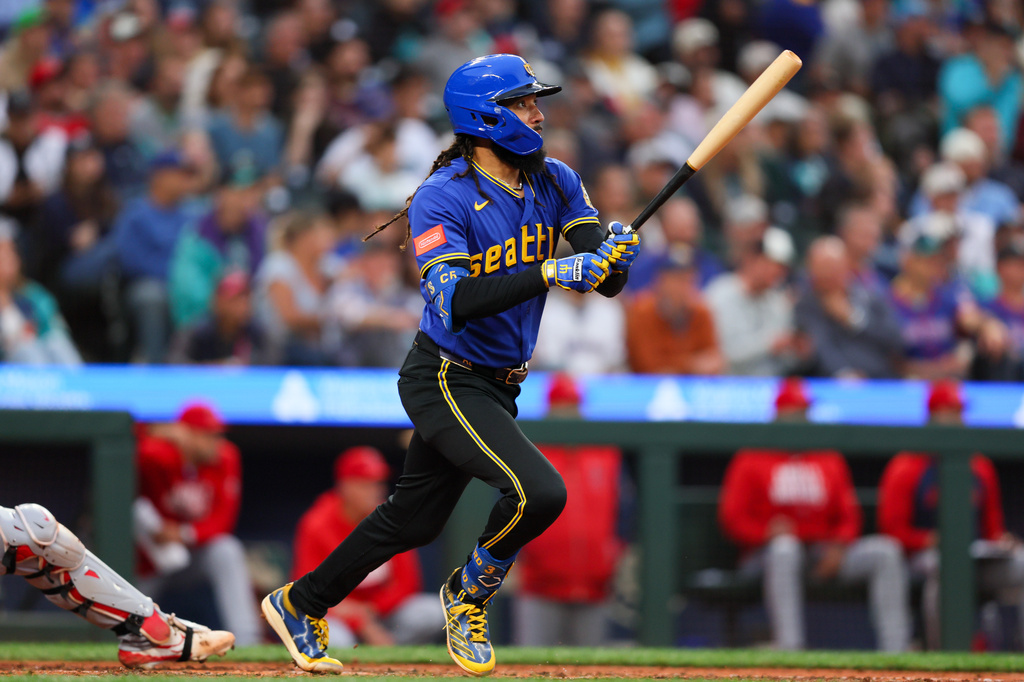 Seattle Mariners' J.P. Crawford doubles in the sixth inning of a baseball game against the Los Angeles Angels, Thursday, July 2, 2026, in Seattle. (AP Photo/Kevin Ng)