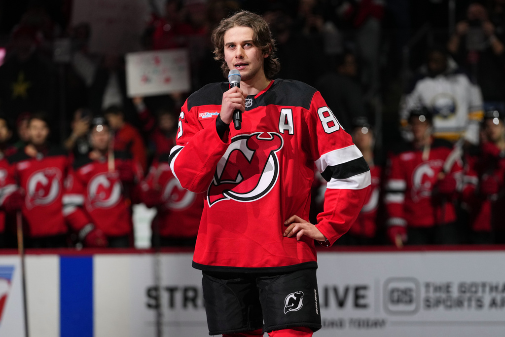 New Jersey Devils' Jack Hughes speaks to fans before an NHL hockey game against the Buffalo Sabres Wednesday, Feb. 25, 2026, in Newark, N.J. (AP Photo/Frank Franklin II)