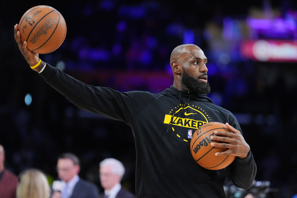 Los Angeles Lakers forward LeBron James warms up before the team's NBA basketball game against the Golden State Warriors Saturday, Feb. 7, 2026, in Los Angeles. (AP Photo/Jae C. Hong)