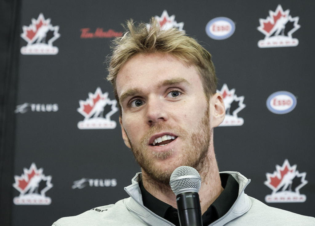 Team Canada hockey player Connor McDavid speaks to the media at Hockey Canada's National Teams orientation camp in Calgary, Alberta, Wednesday, Aug. 27, 2025. (Jeff McIntosh/The Canadian Press via AP)