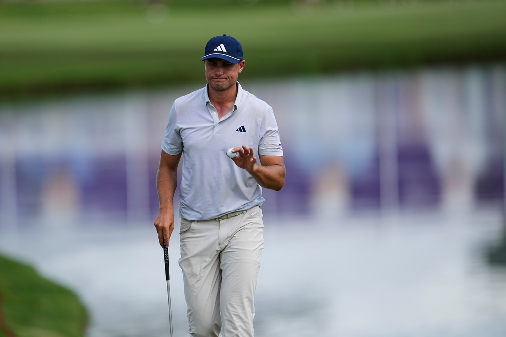 Ludvig Aberg, of Sweden, after putting in on the 18th hole during the second round of the St. Jude Championship golf tournament Friday, Aug. 14, 2026, in Memphis, Tenn. (AP Photo/George Walker IV)