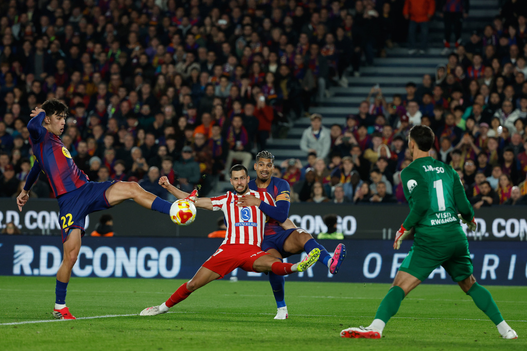 Barcelona's Marc Bernal scores his side's third goal during the Copa del Rey semifinal second leg soccer match between Barcelona and Atletico Madrid in Barcelona, Spain, Tuesday, March 3, 2026. (AP Photo/Joan Monfort)